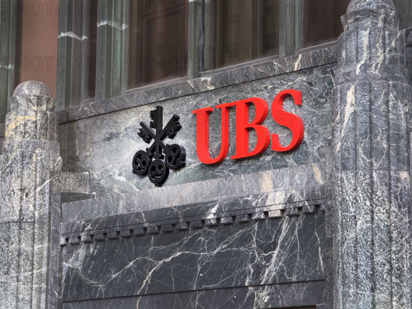 UBS Group AB, office building exterior with company logo and sign above entrance, New York City, New York, USA