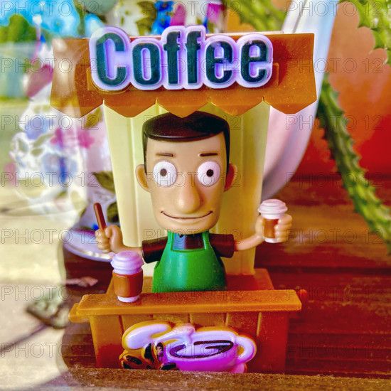 Miniature plastic coffee barista  in window display