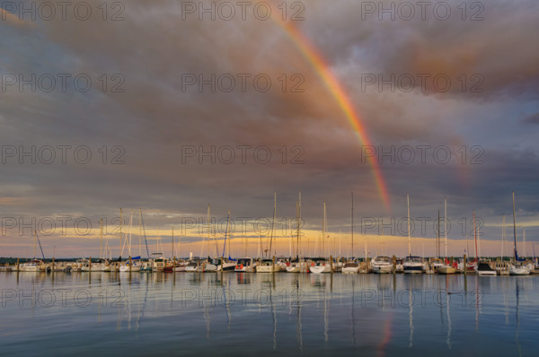 Rainbow and dramatic sky over harbor, Traverse City, Michigan, USA