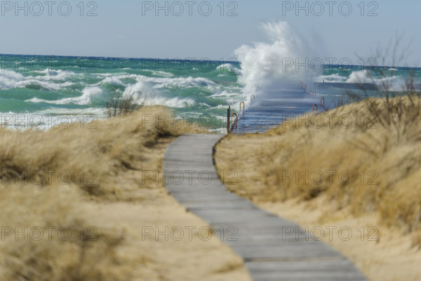 Waves crashing on dock, Lake Michigan, Frankfort, Michigan, USA