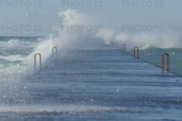 Waves crashing on dock, Lake Michigan, Frankfort, Michigan, USA