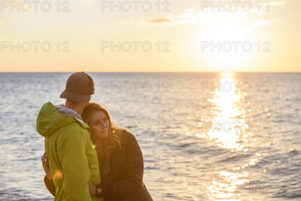 Affectionate couple enjoying sunset at beach