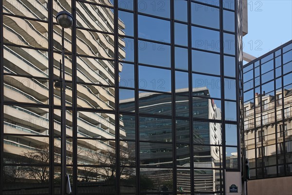 France, reflections in a glass building