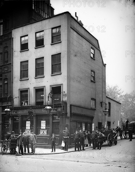 Crowd outside Ye Old Bell tavern in Pall Mall, London,  Artist