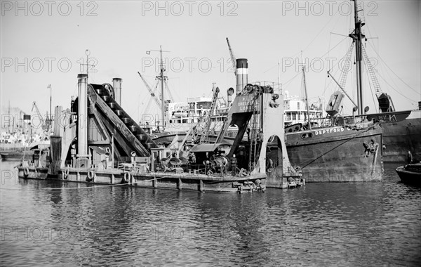 A dredger moored in Tilbury Docks, Essex, c1945-c1965