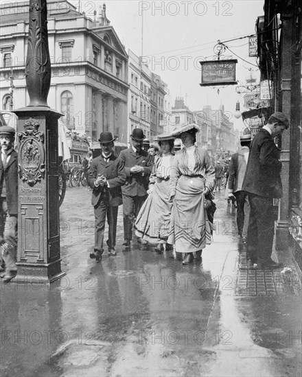 Two suffragettes walking along a pavement, London, 1900s. Artist: Unknown