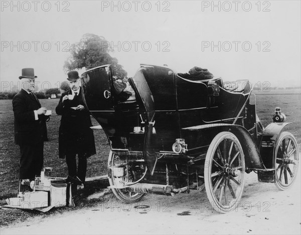 Men having tea beside a 1901 Panhard, (c1901?). Artist: Unknown