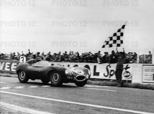 Ken Wharton in a Jaguar D Type, Rheims 12 Hours Race, France, 3rd July 1954. Artist: Unknown