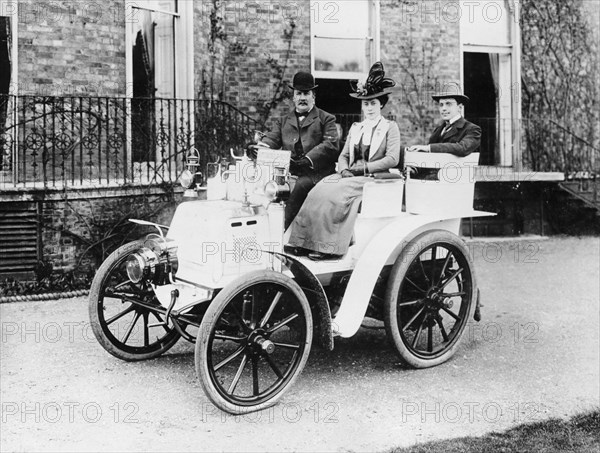 Frank Butler and daughter on a 6hp Panhard, 1900. Artist: Unknown