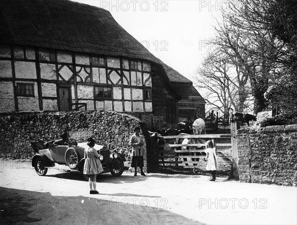 Calcott 2-seater car parked outside a farm gate, c1921-c1922. Artist: Unknown