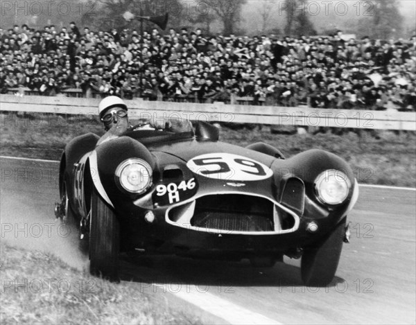 Stirling Moss diving an Aston Martin DB3S, Goodwood, West Sussex, 1956. Artist: Unknown