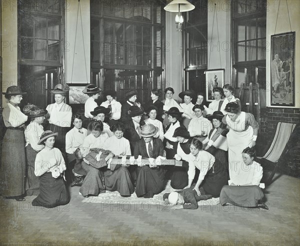 First aid class for women, Montem Street Evening Institute, London, 1913. Artist: Unknown.