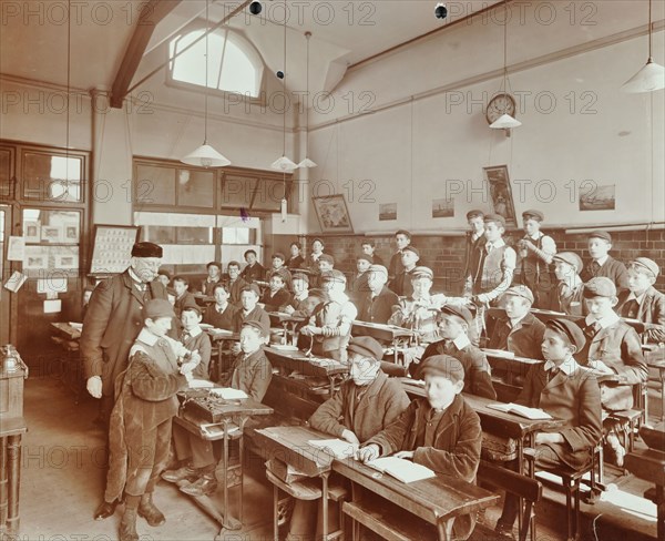 Boys laying the phylacteries, Jews' Free School, Stepney, London, 1908. Artist: Unknown.