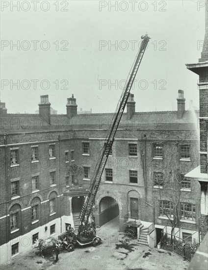 Firemen demonstrating the magirus ladder, London Fire Brigade Headquarters, London, 1910. Artist: Unknown.