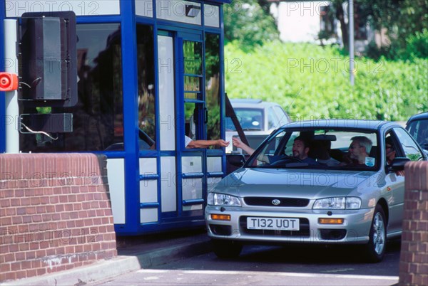 Subaru using toll booth on Itchen bridge, Southampton. Artist: Unknown.