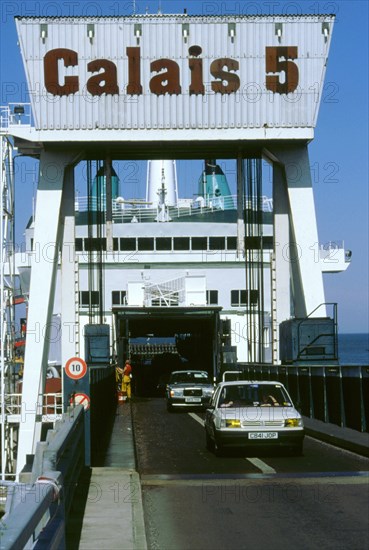 Cars boarding ferry at Calais. Artist: Unknown.