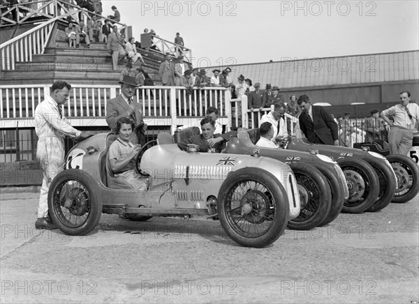 Austin 7 works team, Brooklands 1937. Artist: Bill Brunell.