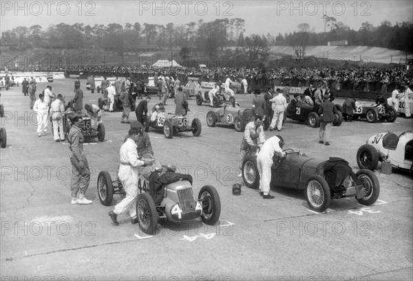 Cars on the starting grid for the JCC International Trophy, Brooklands, 2 May 1936. Artist: Bill Brunell.