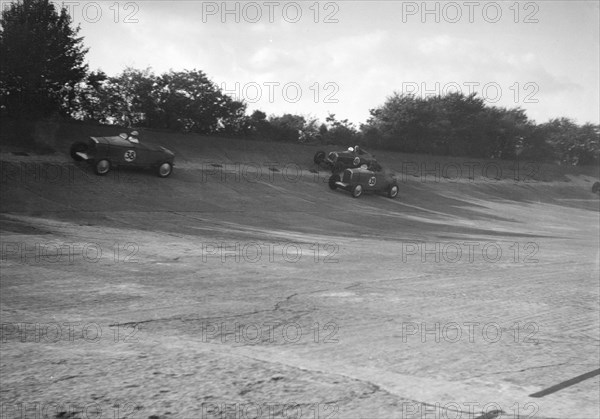 John Cobb and Tim Rose-Richards' Talbot 105s, BRDC 500 Mile Race, Byfleet Banking, Brooklands, 1931. Artist: Bill Brunell.