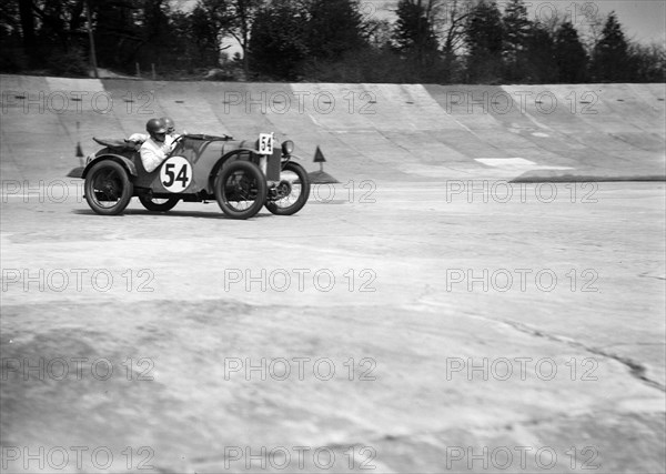 Austin Ulster of Victoria Worsley and R Latham-Boote, JCC Double Twelve race, Brooklands, 1931. Artist: Bill Brunell.