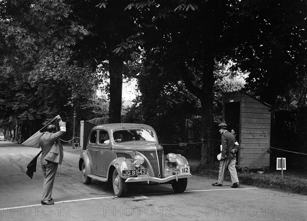 JB Thompson's Ford V8 on the way to winning bronze in the MCC Torquay Rally, July 1937. Artist: Bill Brunell.