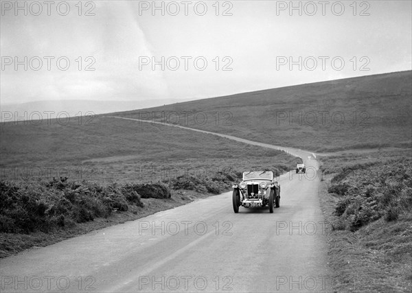 Cream Cracker Team MG PA of JA Bastock competing at the MCC Torquay Rally, July 1937. Artist: Bill Brunell.