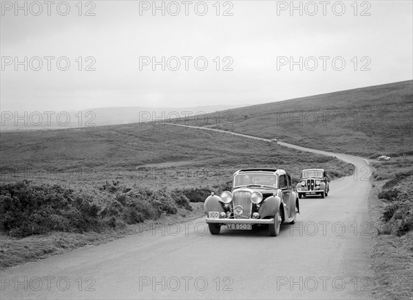 SS Stanley's Jaguar SS leading RS Mantle's Standard Flying 12 at the MCC Torquay Rally, July 1937. Artist: Bill Brunell.