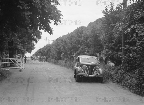 GM Denton's Ford V8, winner of a bronze award at the MCC Torquay Rally, July 1937. Artist: Bill Brunell.