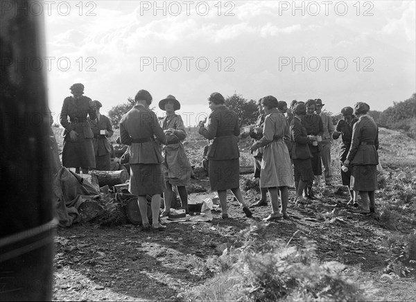 Women at a First Aid Nursing Yeomanry (FANY) trial or rally, 1931.   Artist: Bill Brunell.