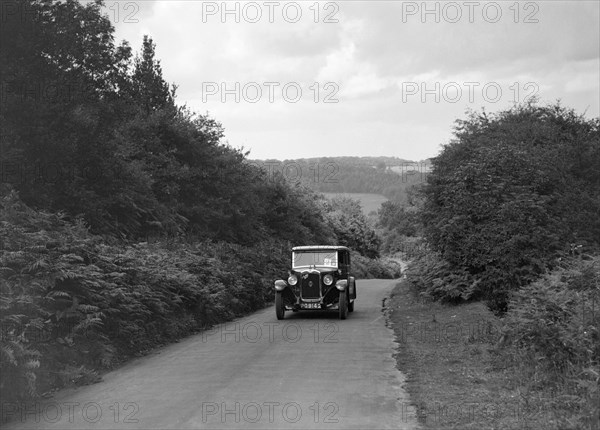 Austin 16/6 taking part in a First Aid Nursing Yeomanry trial or rally, 1931. Artist: Bill Brunell.