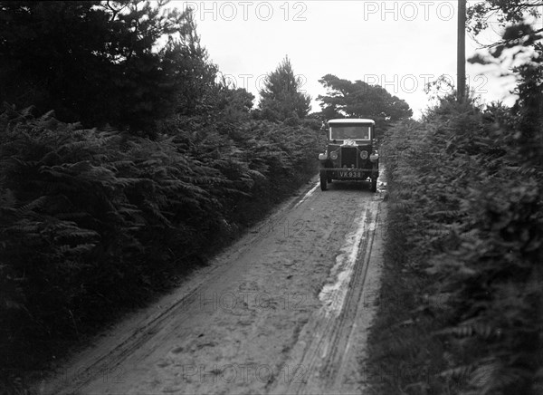 Morris Minor taking part in a First Aid Nursing Yeomanry trial or rally, 1931. Artist: Bill Brunell.