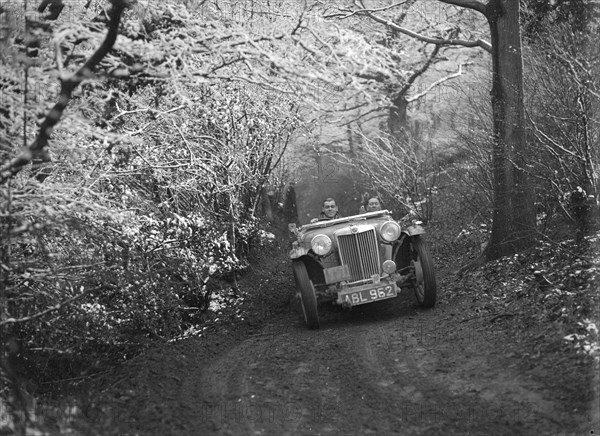 1936 MG TA of the Cream Cracker Team taking part in a motoring trial, late 1930s. Artist: Bill Brunell.