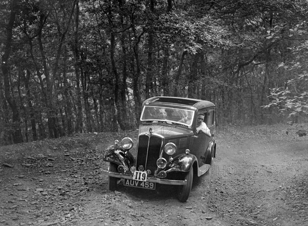 Standard competing in the B&HMC Brighton-Beer Trial, Fingle Bridge Hill, Devon, 1934. Artist: Bill Brunell.