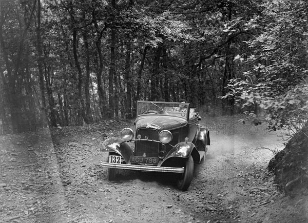 Ford V8 competing in the B&HMC Brighton-Beer Trial, Fingle Bridge Hill, Devon, 1934. Artist: Bill Brunell.