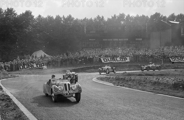 LG Johnson's Frazer-Nash BMW 328 leading two MG PBs, Imperial Trophy, Crystal Palace, 1939. Artist: Bill Brunell.