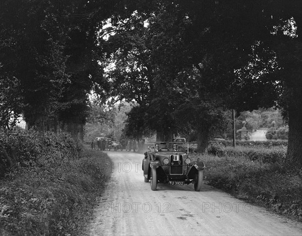 Talbot 18/55 4-seater tourer competing in the JCC Inter-Centre Rally, 1932. Artist: Bill Brunell.