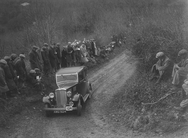 Standard saloon of HF Deane competing in the MCC Lands End Trial, 1935. Artist: Bill Brunell.