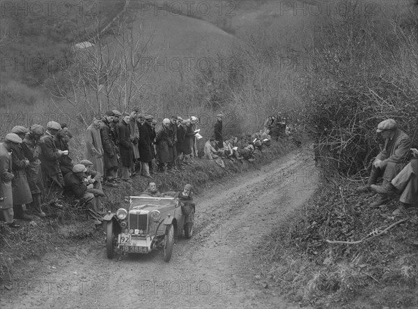 MG PA of Jack Bastock of the Cream Cracker Team competing in the MCC Lands End Trial, 1935. Artist: Bill Brunell.