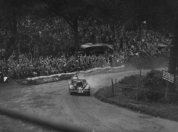 Unidentified car with supercharger competing in the Shelsley Walsh Hillclimb, Worcestershire, 1935. Artist: Bill Brunell.