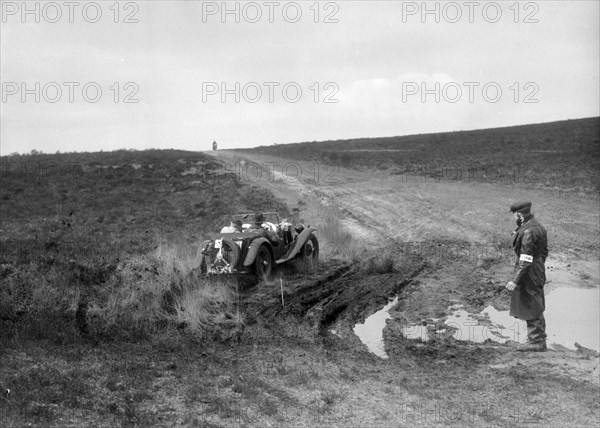 Swept-wing MG J2 competing in a motoring trial, Bagshot Heath, Surrey, 1930s. Artist: Bill Brunell.