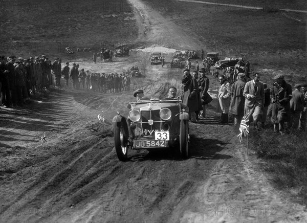 1932 MG J2 competing in a motoring trial, Bagshot Heath, Surrey, 1930s. Artist: Bill Brunell.