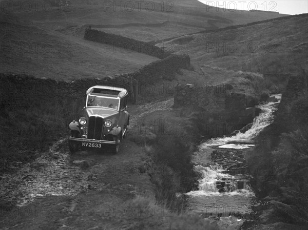 Kitty Brunell road testing a Standard Little Twelve saloon, c1932. Artist: Bill Brunell.