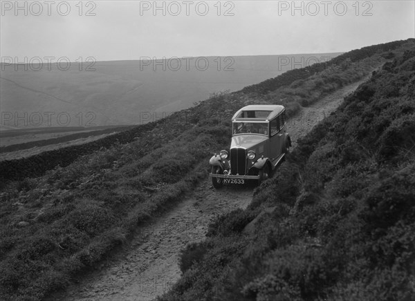 Kitty Brunell road testing a Standard Little Twelve saloon, c1932. Artist: Bill Brunell.