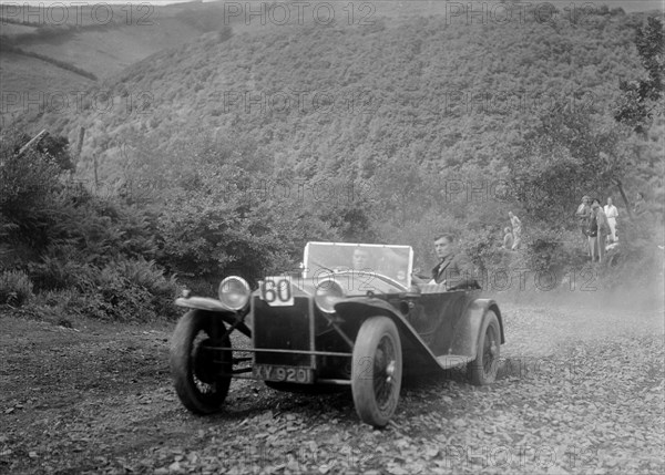 Lancia Lambda open tourer at the Mid Surrey AC Barnstaple Trial, Beggars Roost, Devon, 1934. Artist: Bill Brunell.