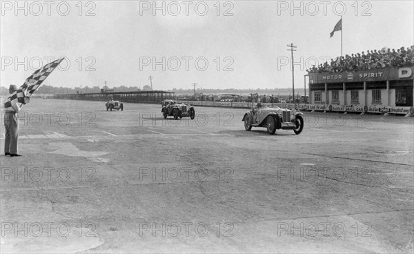 MG Magna of SG Cummings winning a race, BARC meeting, Brooklands, Surrey, 1933. Artist: Bill Brunell.