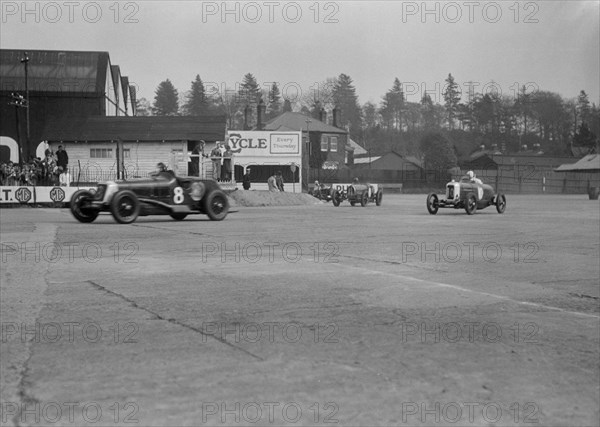 Maserati of Richard Oats leading George Harvey-Noble's Bugatti and a Salmson, Brooklands, 1930s. Artist: Bill Brunell.