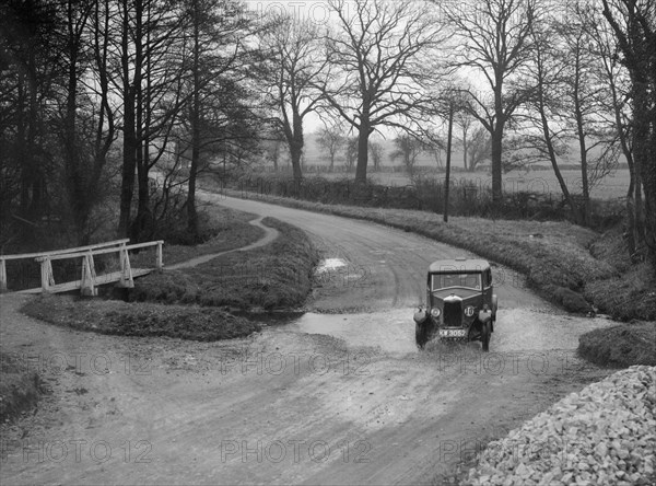 Riley 9 of HC Holm competing in the Ilkley & District Motor Club Trial, Yorkshire, 1930s. Artist: Bill Brunell.