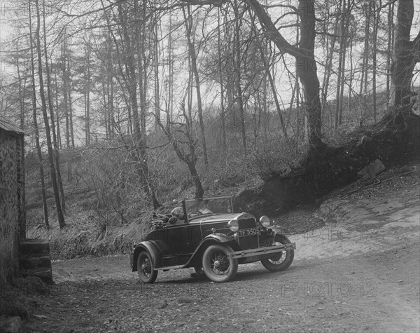 Kitty Brunell driving a 1930 2-seater Ford Model A, 1931.   Artist: Bill Brunell.