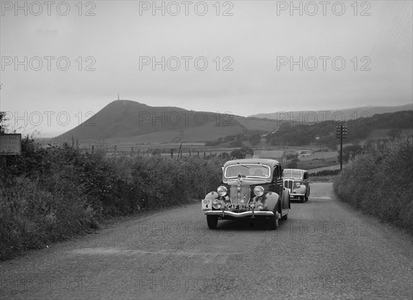 Ford V8 saloon of HJ Parsons competing in the South Wales Auto Club Welsh Rally, 1937 Artist: Bill Brunell.