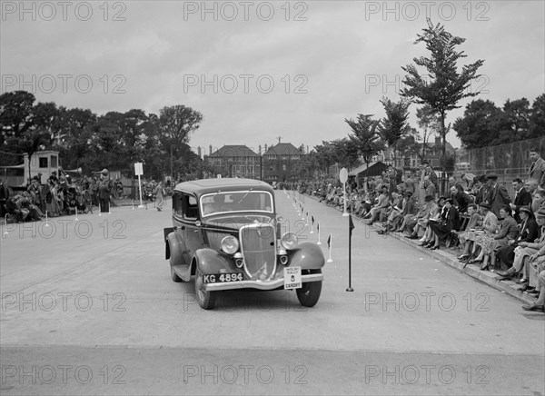 Ford V8 saloon of AE Harris competing in the South Wales Auto Club Welsh Rally, 1937 Artist: Bill Brunell.